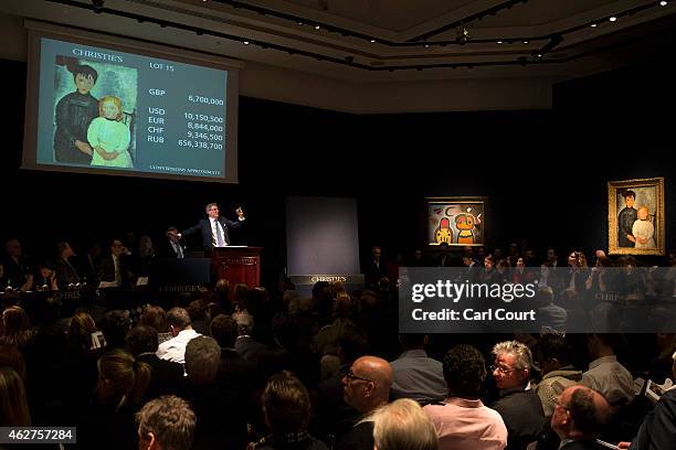 Auctioneer Jussi Pylkkanen takes bids for 'Les deux filles' by Amedeo Modigliani at Christies on February 04, 2015 in London, England. Forming part...