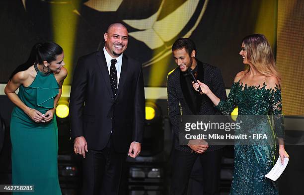 Presenter Fernanda Lima speaks with model Adriana Lima, Ronaldo and Neymar of Brazil during the FIFA Ballon d'Or Gala 2013 at the Kongresshaus on...