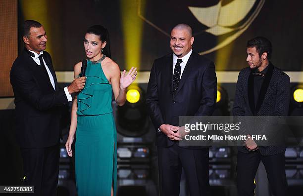 Presenter Ruud Gullit speaks with model Adriana Lima, Ronaldo and Neymar of Brazil during the FIFA Ballon d'Or Gala 2013 at the Kongresshaus on...
