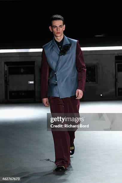 Model walks the runway during the 20/04 Hommes Menswear Fall/Winter 2014-2015 show as part of Paris Fashion Week on January 15, 2014 in Paris, France.