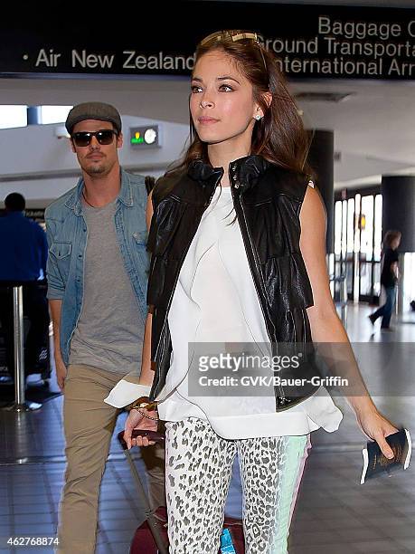 Kristin Kreuk and Jay Ryan are seen at Los Angeles International Airport on July 30, 2012 in Los Angeles, California.
