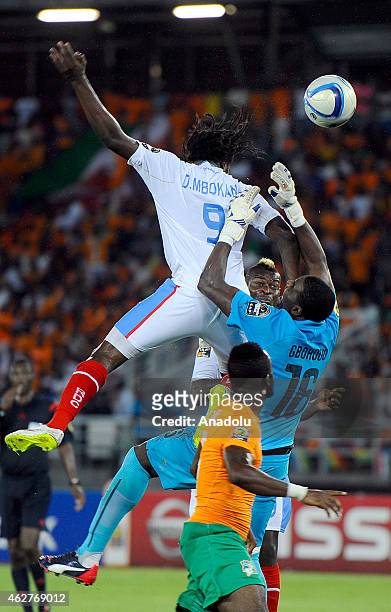 Dieumerci Mbokani of Congo in action against Ivory Coast's goalkeeper Sylvain Gbohouo during the 2015 African Cup of Nations semi-final football...