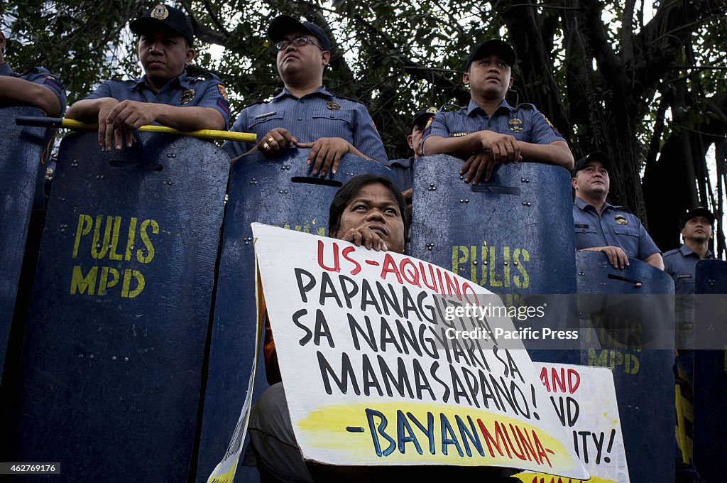 A militant hold his banner calling the Aquino regime...