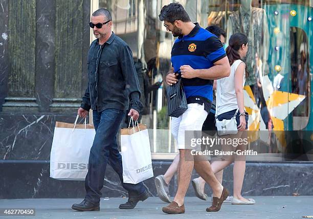 George Michael and his boyfriend Fadi Fawaz are seen on July 31, 2012 in Barcelona, Spain.