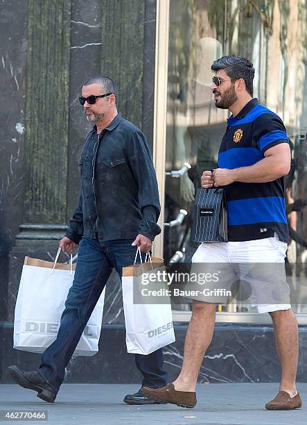 George Michael and his boyfriend Fadi Fawaz are seen on July 31, 2012 in Barcelona, Spain.