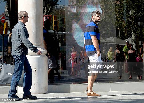 George Michael and his boyfriend Fadi Fawaz are seen on July 31, 2012 in Barcelona, Spain.