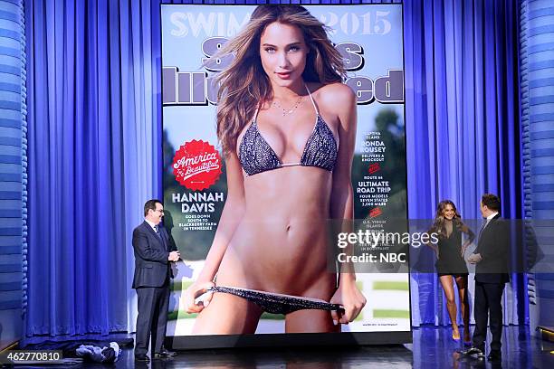 Episode 0204 -- Pictured: Announcer Steve Higgins, model Hannah Davis and host Jimmy Fallon reveal the 2015 Sports Illustrated Swimsuit Issue cover...