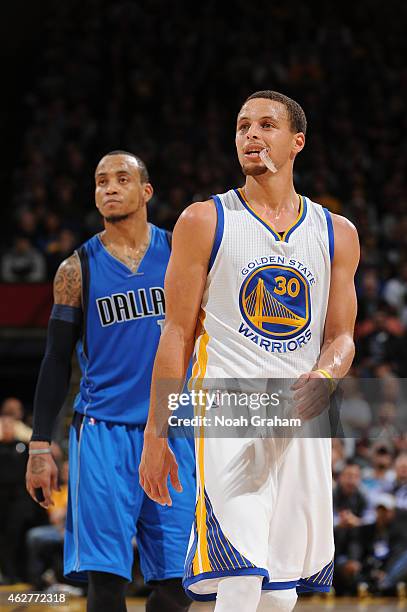 Monta Ellis of the Dallas Mavericks and Stephen Curry of the Golden State Warriors on February 4, 2015 at Oracle Arena in Oakland, California. NOTE...
