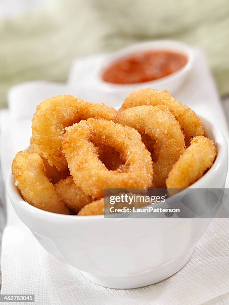 calamari rings with tomato sauce - onion ring stock pictures, royalty-free photos & images