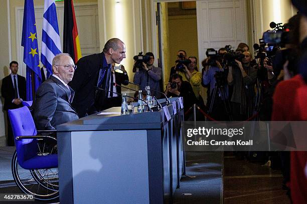 New Greek Finance Minister Yanis Varoufakis and German Finance Minister Wolfgang Schaeuble arrive to speak to the media following talks on February...