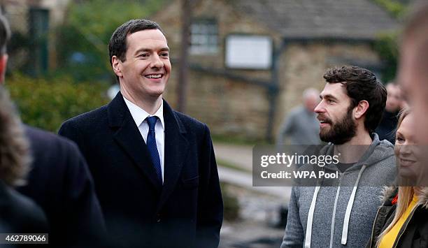 Kelvin Fletcher and the Chancellor Of The Exchequer George Osborne during a visit to the set of television series Emmerdale on the Harewood Estate on...