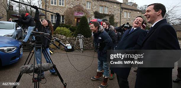 Chancellor Of The Exchequer George Osborne and Prime Minister David Cameron watch a scene being filmed on the set of television series Emmerdale on...