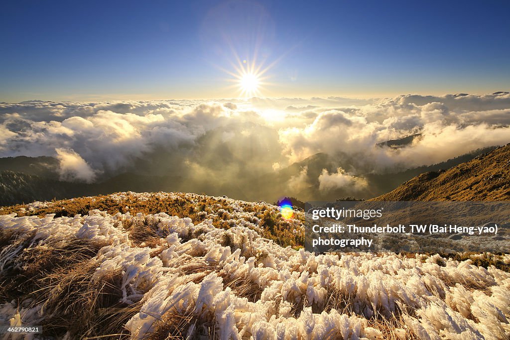 Sunset of high mountain in snowy winter day