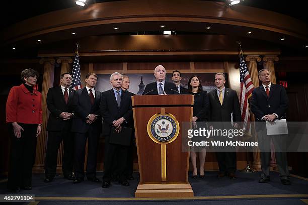 Sen. John McCain , joined by a group of bipartisan senators, speaks during a press conference at the U.S. Capitol February 5, 2015 in Washington, DC....
