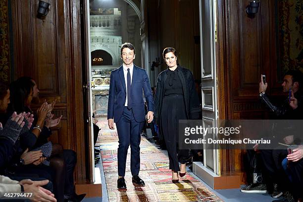 Designers Pier Paolo Piccioli and Maria Grazia Chiuri acknowledge the applause of the audience at the end of the Valentino Menswear Fall/Winter...