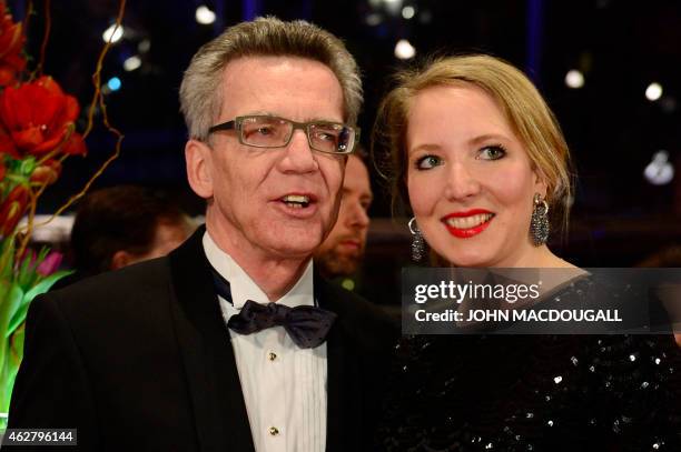 German Interior Minister Thomas de Maiziere and his daughter Nora arrive for the premiere screening of the film 'Nadie quiere la noche' presented in...