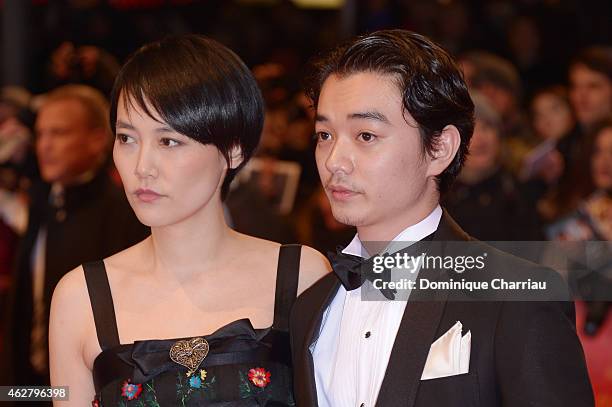 Actress Rinko Kikuchi and her husband actor Shota Sometani attends the 'Nobody Wants the Night' Opening Night premiere during the 65th Berlinale...