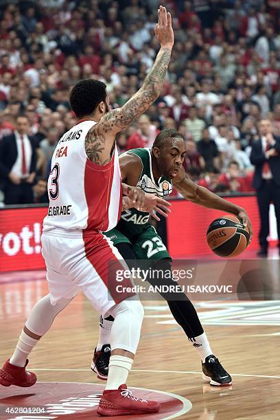 Zalgiris Kaunas' US forward James Anderson vies with Red Star Belgrade's US guard Marcus Williams during the Euroleague Top 16 group E basketball...