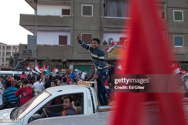 Supporters of Egyptian Defense Minister Abdel Fattah al-Sisi celebrate at the end of the second day of voting in Egypt's constitutional referendum in...