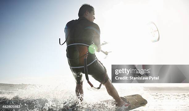 kitesurfer on sea - sunny day stock pictures, royalty-free photos & images