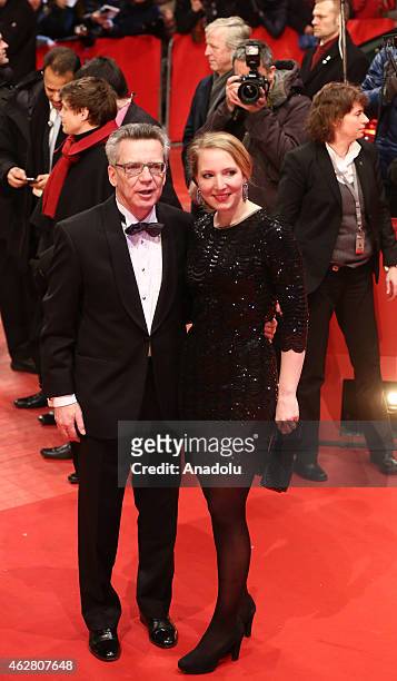 German Interior Minister Thomas de Maiziere and his daughter Nora arrive for the 'Nobody Wants the Night' premiere and the opening gala of the 65th...
