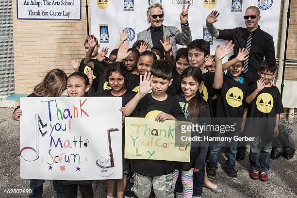 Matt Sorum and Carter Lay attend the Adopt the Arts Ribbon-Cutting Ceremony at Westminster Elementary School on February 5, 2015 in Venice,...