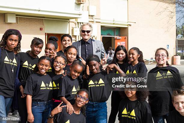 Matt Sorum and students pose for a shot at the Adopt the Arts Ribbon-Cutting Ceremony at Westminster Elementary School on February 5, 2015 in Venice,...