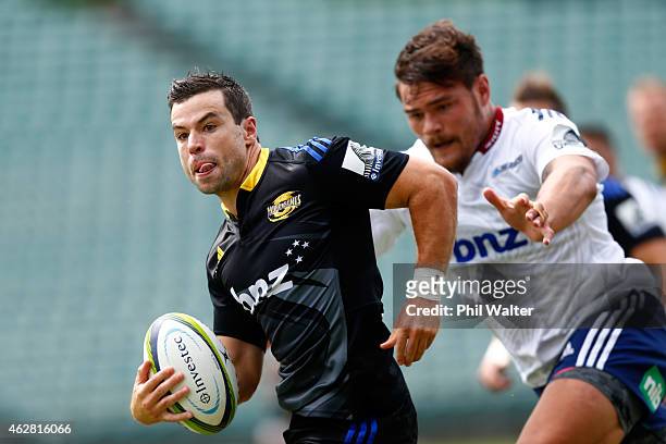 James Marshall of the Hurricanes makes a break away during the Super Rugby pre-season match between the Blues and the Hurricanes at QBE Stadium on...