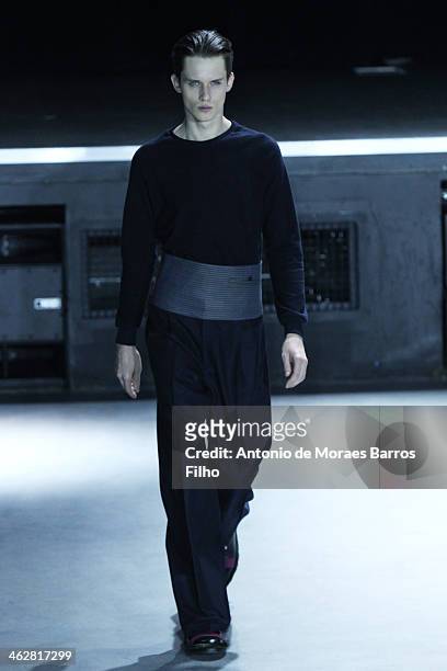 Model walks the runway during the 20/04 Hommes Menswear Fall/Winter 2014-2015 show as part of Paris Fashion Week on January 15, 2014 in Paris, France.