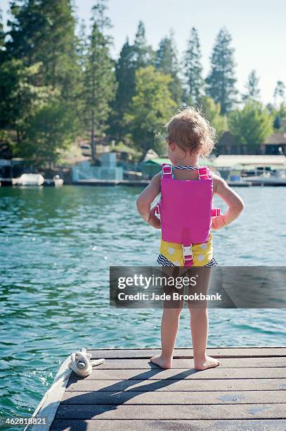 little girl standing on dock - lake arrowhead california stock pictures, royalty-free photos & images