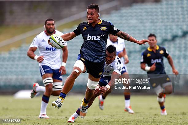 Vaea Fifita of the Hurricanes is tackled during the Super Rugby pre-season match between the Blues and the Hurricanes at QBE Stadium on February 6,...