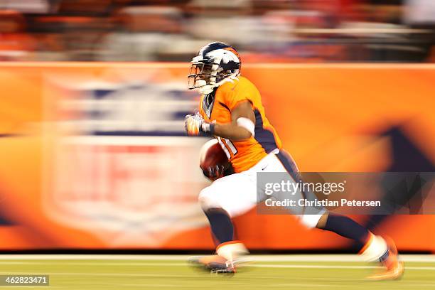 Trindon Holliday of the Denver Broncos carries the ball during the AFC Divisional Playoff Game against the San Diego Chargers at Sports Authority...