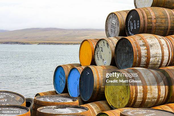 whisky barrels on the coast of islay - scotch whisky stock-fotos und bilder