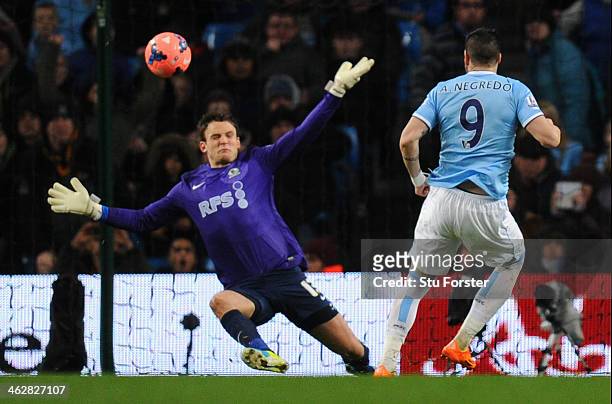 Alvaro Negredo of Manchester City scores the second goal past Simon Eastwood of Blackburn Rovers during the Budweiser FA Cup Third Round Replay match...