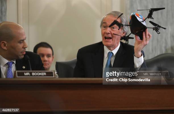 Commerce, Science and Transportation Committee member Sen. Edward Markey holds up a small four-bladed remote controlled helicopter during a hearing...