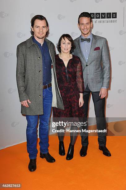 Felix Klare, Eva Loebau and Vladimir Burlakov attends the premiere of the film 'Der Clan. Die Geschichte der Familie Wagner' at Gloria Palast on...