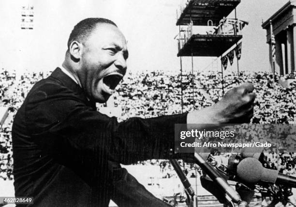 American Civil Rights and religious leader Dr Martin Luther King Jr gestures emphatically during a speech at a Chicago Freedom Movement rally in...
