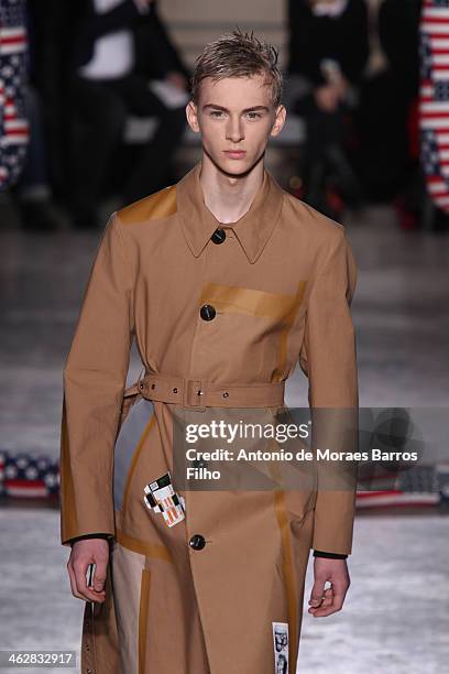 Model walks the runway during the Raf Simons/Sterling Ruby Menswear Fall/Winter 2014-2015 show as part of Paris Fashion Week on January 15, 2014 in...