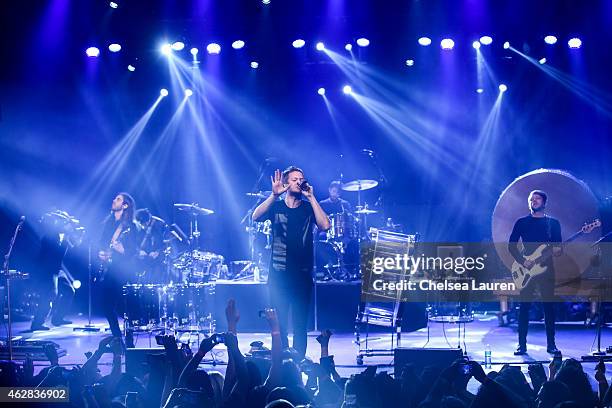 Musicians Daniel Wayne Sermon, Dan Reynolds, Dan Platzman and Ben McKee of Imagine Dragons perform at their 'Smoke + Mirrors' North American tour...