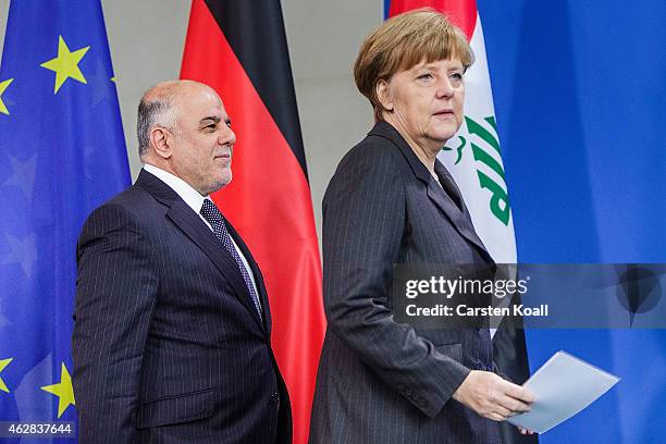 German Chancellor Angela Merkel and Iraqi Prime Minister Haider Al-Abadi arrive for a press conference at the Chancellery following talks on February...