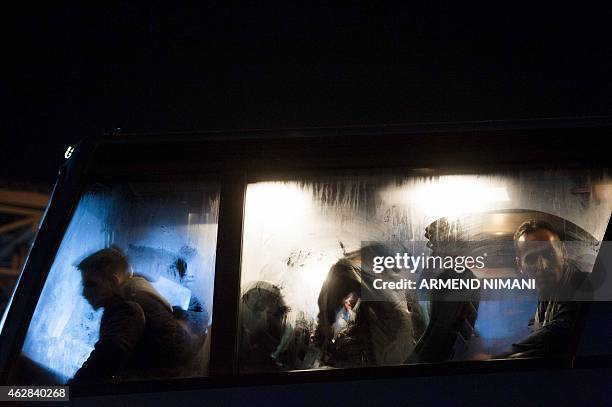 Kosovo Albanians board a bus in Pristina on February 5, 2015 heading to Serbia, hoping to reach the European Union and seek asylum. Hungary has seen...