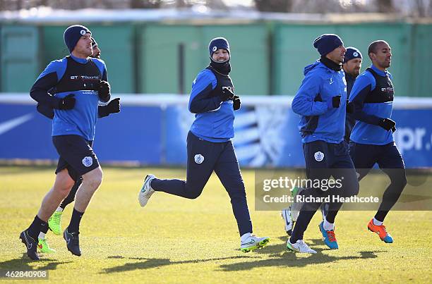 Richard Dunne, Adel Taarabt, Rio Ferdinand and Karl Henry in action during a Queens Park Rangers training session at the Harlington Sports Ground on...