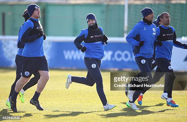 Richard Dunne, Adel Taarabt, Rio Ferdinand and Karl Henry in action during a Queens Park Rangers training session at the Harlington Sports Ground on...