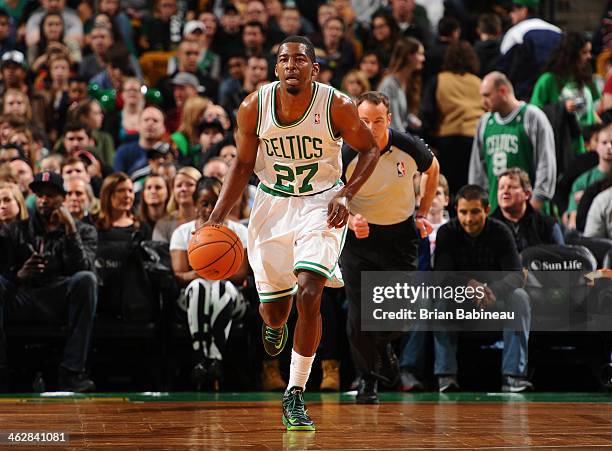 Jordan Crawford of the Boston Celtics moves the ball up-court against the Memphis Grizzlies on November 27, 2013 at the TD Garden in Boston,...
