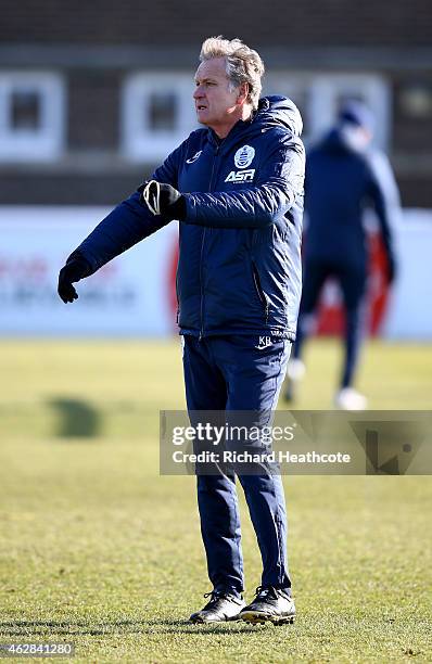 First team coach Kevin Bond in action during a Queens Park Rangers training session at the Harlington Sports Ground on February 6, 2015 in...