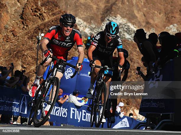 Brent Bookwalter of the USA and the BMC Racing Team and Geraint Thomas of Great Britain and Team SKY cross the finish line on stage three of the...