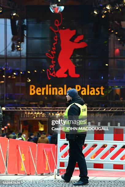 Security staff member stands on the red carpet at the Berlinale Palast during the Premiere screening of the film Taxi by Iranian director Jafar...