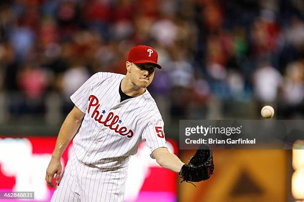 Closer Jonathan Papelbon of the Philadelphia Phillies looks on after giving up a run in the ninth inning of the game against the Atlanta Braves at...