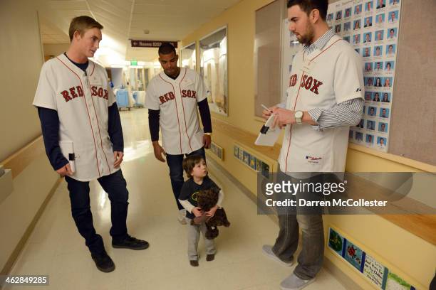 Boston Red Sox rookies Henry Owens, Dalier Hinojosa and Anthony Ranaudo hang out with Joseph at Boston Children's Hospital on January 15, 2014 in...
