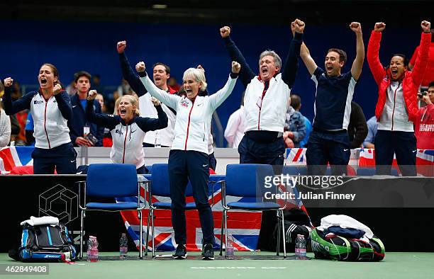 Captain Judy Murray leads the celebrations as Johanna Konta, Louis Cayer, Iain Bates, Anne Keothavong show their support in the doubles match between...